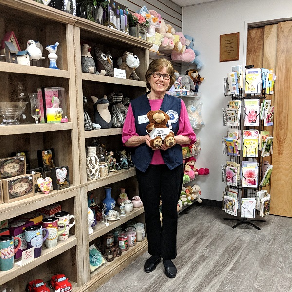 Photo: St. Camillus gift shop employee holding stuffed bear