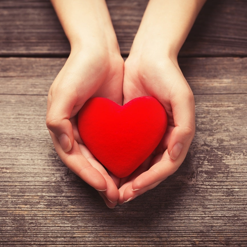 Photo: Hands holding red heart